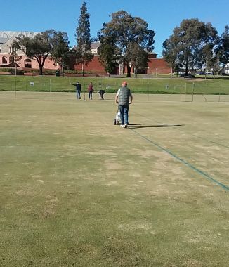 Preparing the courts for the Bendigo Festival of Croquet
