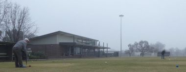 Shepparton Croquet club house 
Two players playing in foggy morning conditions 

